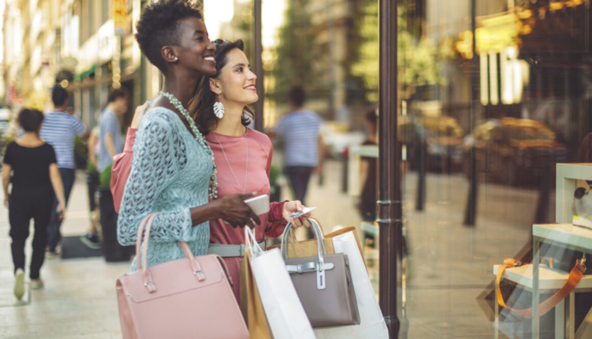 Friends are window shopping in the summer